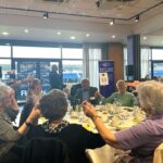 Guests enjoying the party at Sight Loss Shropshire's Spring Day Out whilst singer Tony Wall entertains