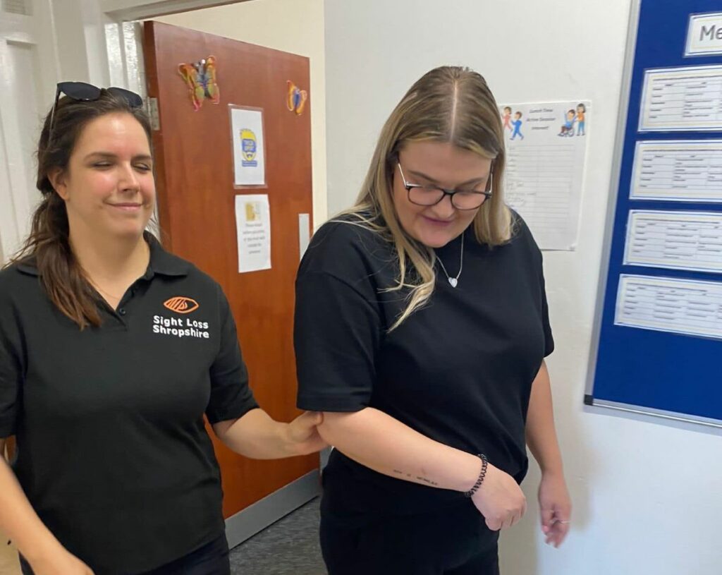 Two people undertaking sighted guide training