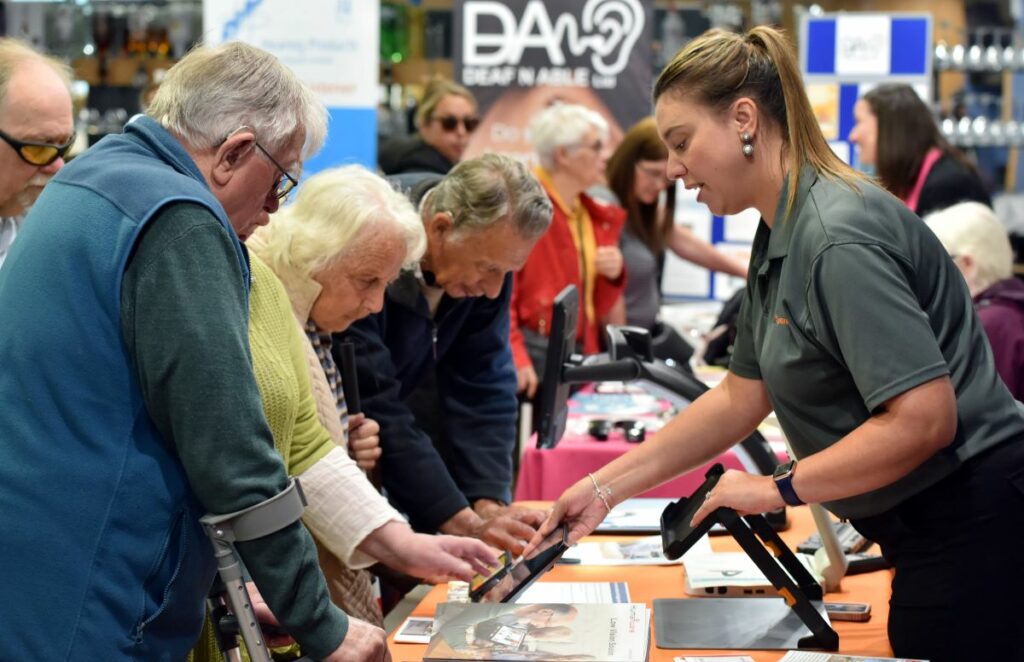 Exhibitors talking to visitors