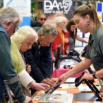 Exhibitors talking to visitors