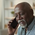 Man listening on phone.
