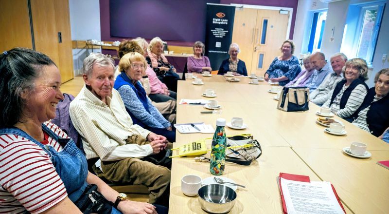 LWWSL MD A group sight loss training session with people sitting around a large table