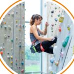 A young person on an indoor climbing wall
