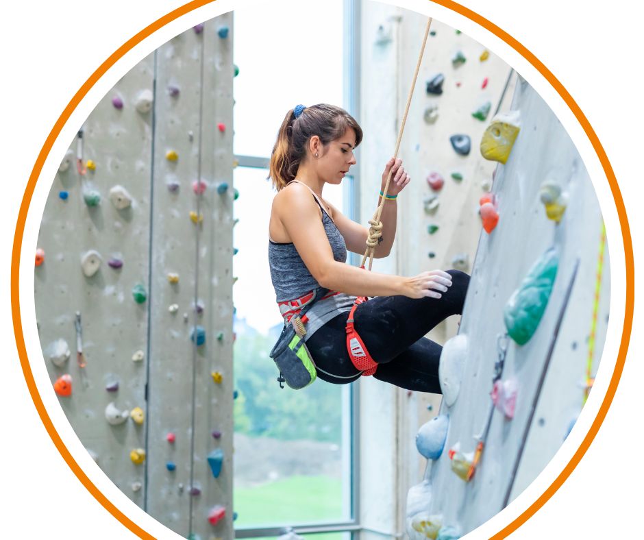 A young person on an indoor climbing wall