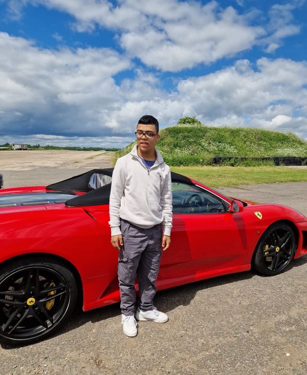 Visually impaired teen with a supercar