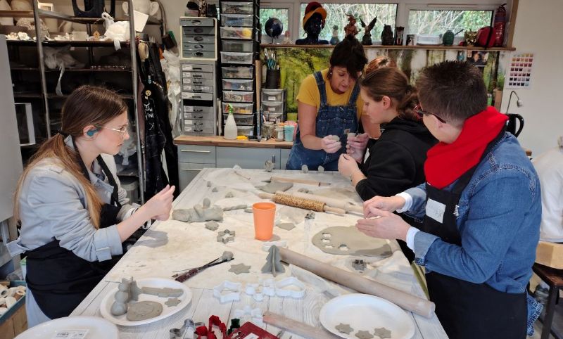 Young people with aight loss enjoying a pottery activity