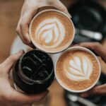 Hands holding coffee and drinks