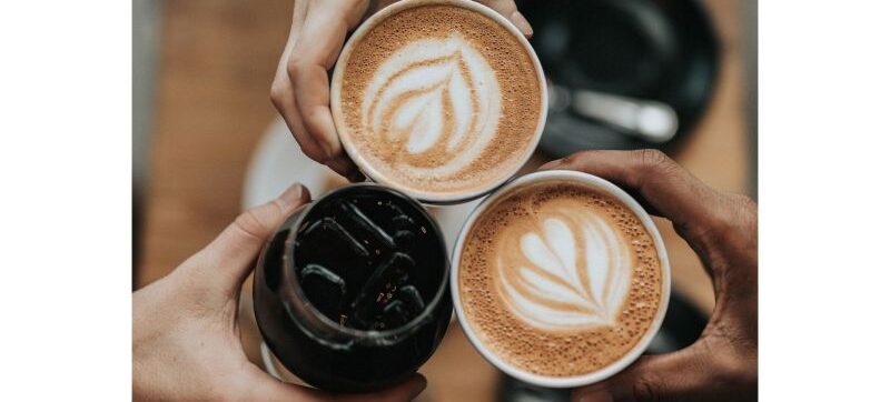 Hands holding coffee and drinks